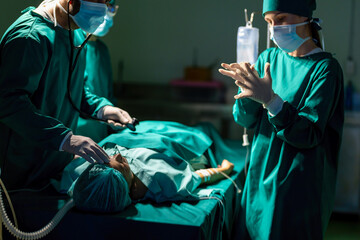 A team of professional doctors perform surgery in a hospital, a group of surgeons working in the operating theater.