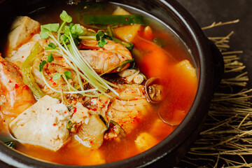 Spicy saengtae (fresh pollack) soup made with fresh pollack, bean curd, radish, crown daisy, and other vegetables and seasoned with red chili powder.