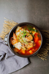 Spicy saengtae (fresh pollack) soup made with fresh pollack, bean curd, radish, crown daisy, and other vegetables and seasoned with red chili powder.