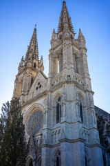 Fototapeta na wymiar View of the magnificent facade of the 'Église Saint-Louis des Chartrons' church in Bordeaux France. Blue sky in autumn