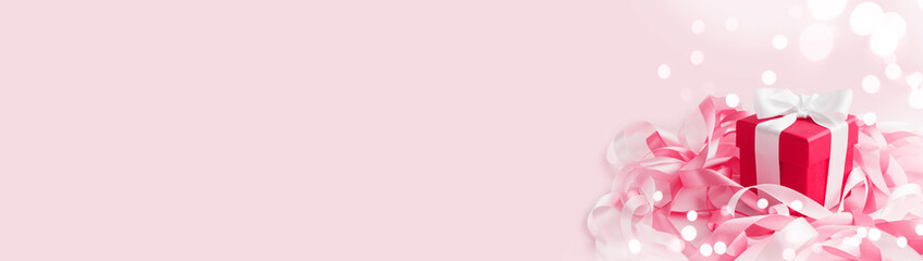 Happy Mother's Day or women's day. Valentine's day. Box with gift in festive ribbons. Greeting card in color of year 2023 Viva Magenta.