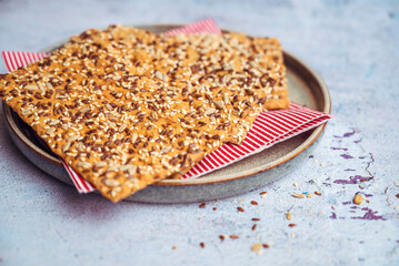 Crispy gluten free crackers with seeds . Healthy whole grain snack 