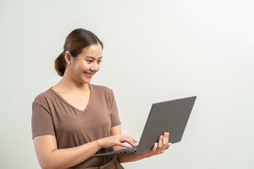Asian women holding laptop computer. Work from home business concept.