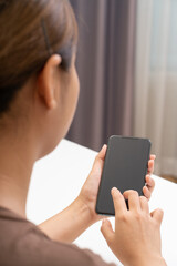Asian women using smartphone. Online business concept.