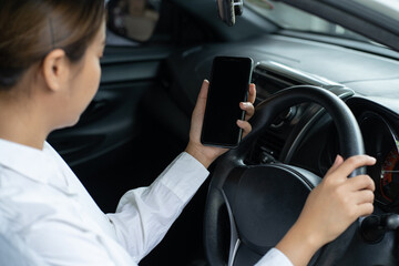 Asian women using smartphone while driving