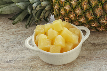 Marinated pineapple slices in the bowl
