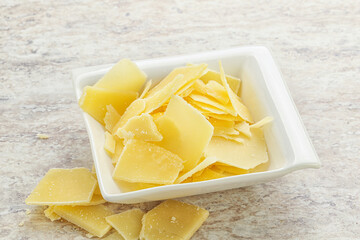 Sliced parmesan cheese heap in the bowl