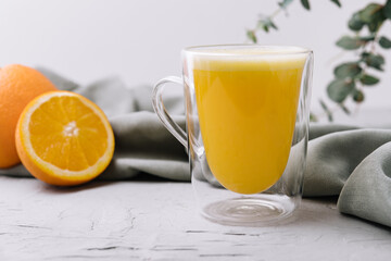 fresh orange juice glass on stone