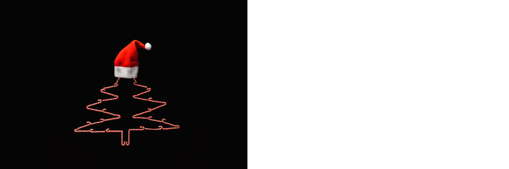 Christmas tree made of caramel cane with Santa hat. Decoration and sweets for the holiday.