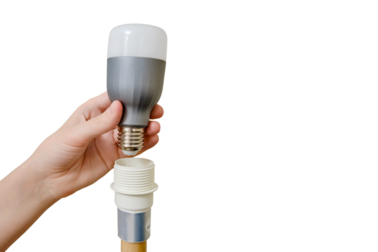 A woman changes an energy-saving light bulb in a floor lamp in a home living room, isolated on a white background - Powered by Adobe