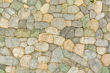 Wall built with natural stones. Natural rocks texture background.