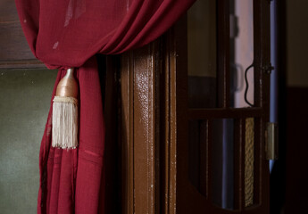 red curtain with a door