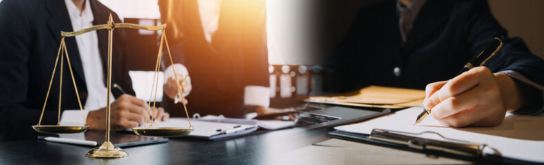 Business and lawyers discussing contract papers with brass scale on desk in office. Law, legal services, advice, justice and law concept picture with film grain effect