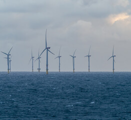 Offshore and Onshore Windmill farm Westermeerwind, Windmill park in the Netherlands with huge large...