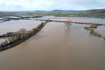 Flooded farm fields after storm in England aerial view