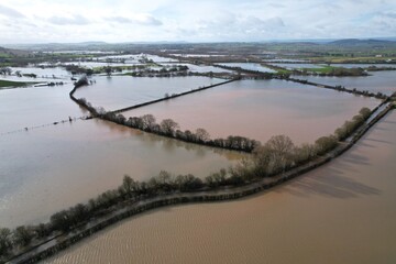 Flooded farm fields after storm in England aerial view