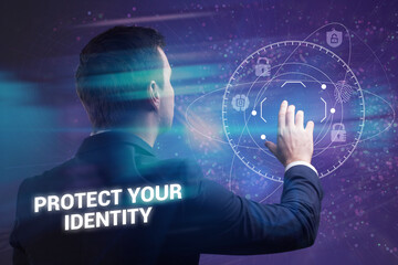 Business, Technology, Internet and network concept. Young businessman working on a virtual screen of the future and sees the inscription: Protect your identity