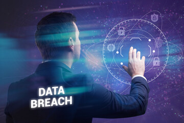 Business, Technology, Internet and network concept. Young businessman working on a virtual screen of the future and sees the inscription: Data breach