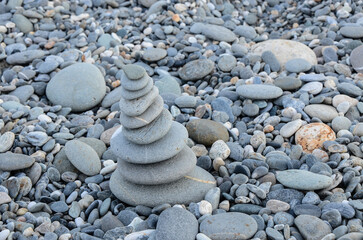 Fototapeta na wymiar Stacking pebble stones to pray