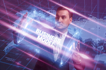 Business, Technology, Internet and network concept. Young businessman working on a virtual screen of the future and sees the inscription: Business model