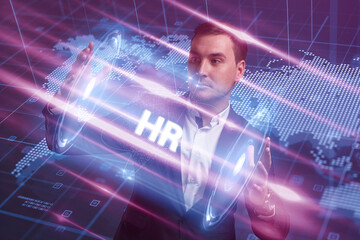 Business, Technology, Internet and network concept. Young businessman working on a virtual screen of the future and sees the inscription: HR