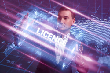 Business, Technology, Internet and network concept. Young businessman working on a virtual screen of the future and sees the inscription: Licence