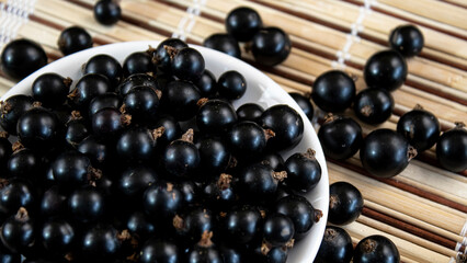 Close-up. Ripe juicy blackcurrant. Summer berries.