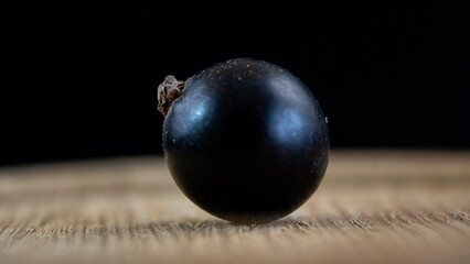 Close-up. Ripe juicy blackcurrant fruits. Summer berries