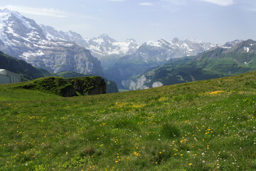 Beautiful view to the valley and the green slopeson a sunny day,