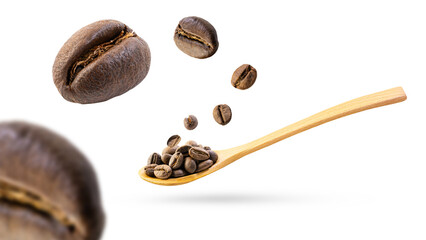 Coffee beans falling into a wooden spoon, isolated on white background