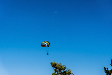 A man parasailing over the bay of Kotor, Montenegro.