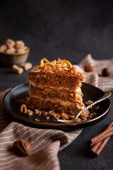 A slice of delicious homeade cake with walnus and cinnamon