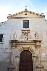 Fototapeta premium Baroque facade of the Catholic church of San Miguel in Murcia, with sculptures of saints 