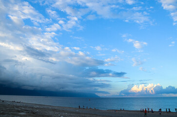 The sea has a sea level, blue sky and white clouds