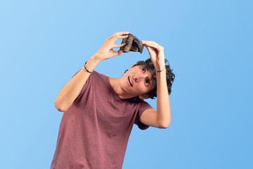 Broke young man with empty wallet on flat lay.