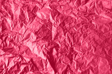 Fototapeta premium Crumpled paper Viva Magenta color of the year 2023. Texture crumpled paper for your design. Copy space. Viva Magenta color paper.