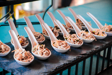 Spicy Fish and Spice Salad put a ceramic spoon Arranged beautifully on the countertop.