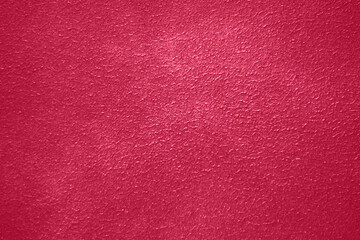 Viva Magenta toned colour grunge decorative navy dark wall background. Art rough stylized texture banner trendy color 2023. Grunge Viva Magenta color texture