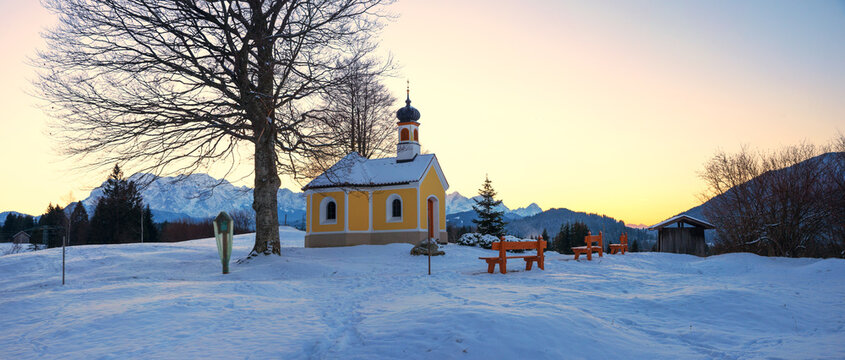 famous chapel near Krun, winter landscape bavarian alps at sunset