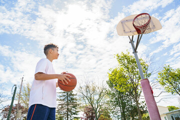cute Afro american players playing basketball outdoors