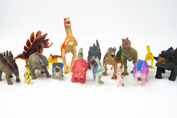 A large group of children's dinosaur toys