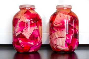 canned white cabbage with beets in glass jars. Salting and pickling cabbage