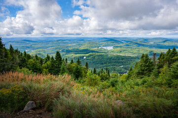 Obraz premium Wonderful view over the valley and its lush foliage, from mount Kaaikop, Laurentides, QC, Canada