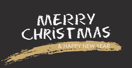 merry christmas handwritten with chalk on a black chalkboard