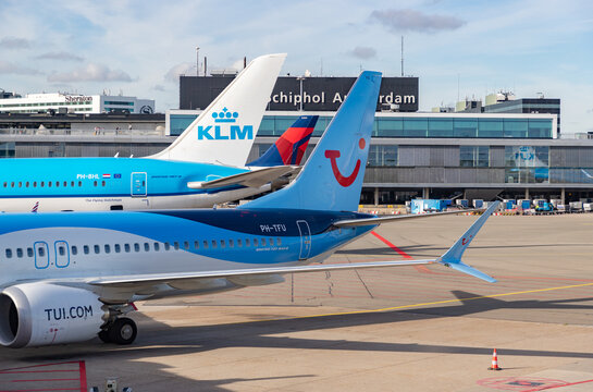 Amsterdam, Netherlands - October 19, 2022: A Picture Of Multiple Planes In The Schiphol Airport.