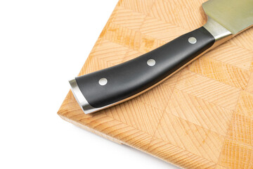 Black handle of kitchen cooking knife on the wooden board