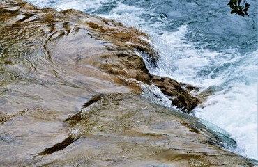 Fresh clean water from the river with stone