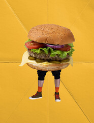 Contemporary art collage. Male legs in sneakers with delicious burger body isolated over yellow...