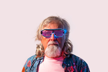 Senior male in led rave glasses in studio