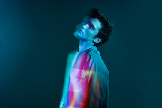 Young man profile in neon illumination